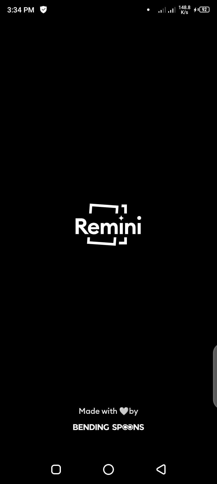 Remini app splash screen on Android showing the Remini logo right after the app is opened